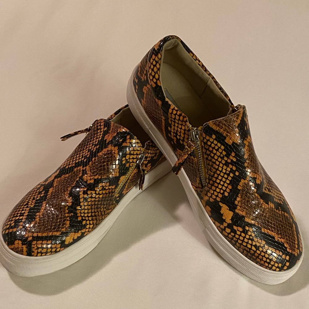 Steve Madden slip on sneaker. Size 10 snakeskin with zipper detail. Worn twice.